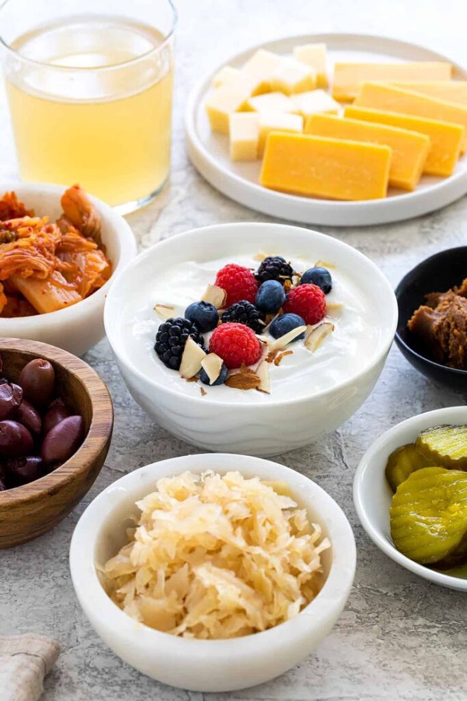 Yogurt: Contains live cultures that promote healthy gut flora.

Kefir: Fermented milk drink with multiple probiotic strains.

Sauerkraut: Fermented cabbage rich in lactic acid bacteria.

Kimchi: Korean fermented vegetables that improve skin hydration.

Miso & Tempeh: Fermented soy products that boost skin barrier function.

Kombucha: Fermented tea with detoxifying benefits.